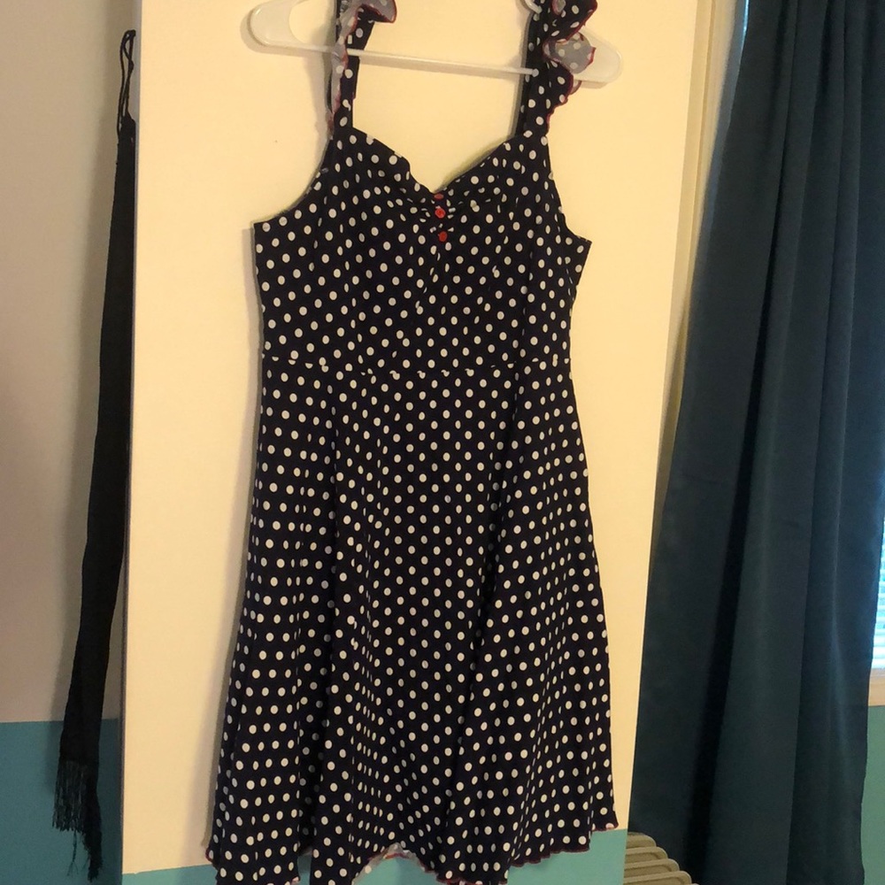 Blue and white polkadot sundress, with red accents
